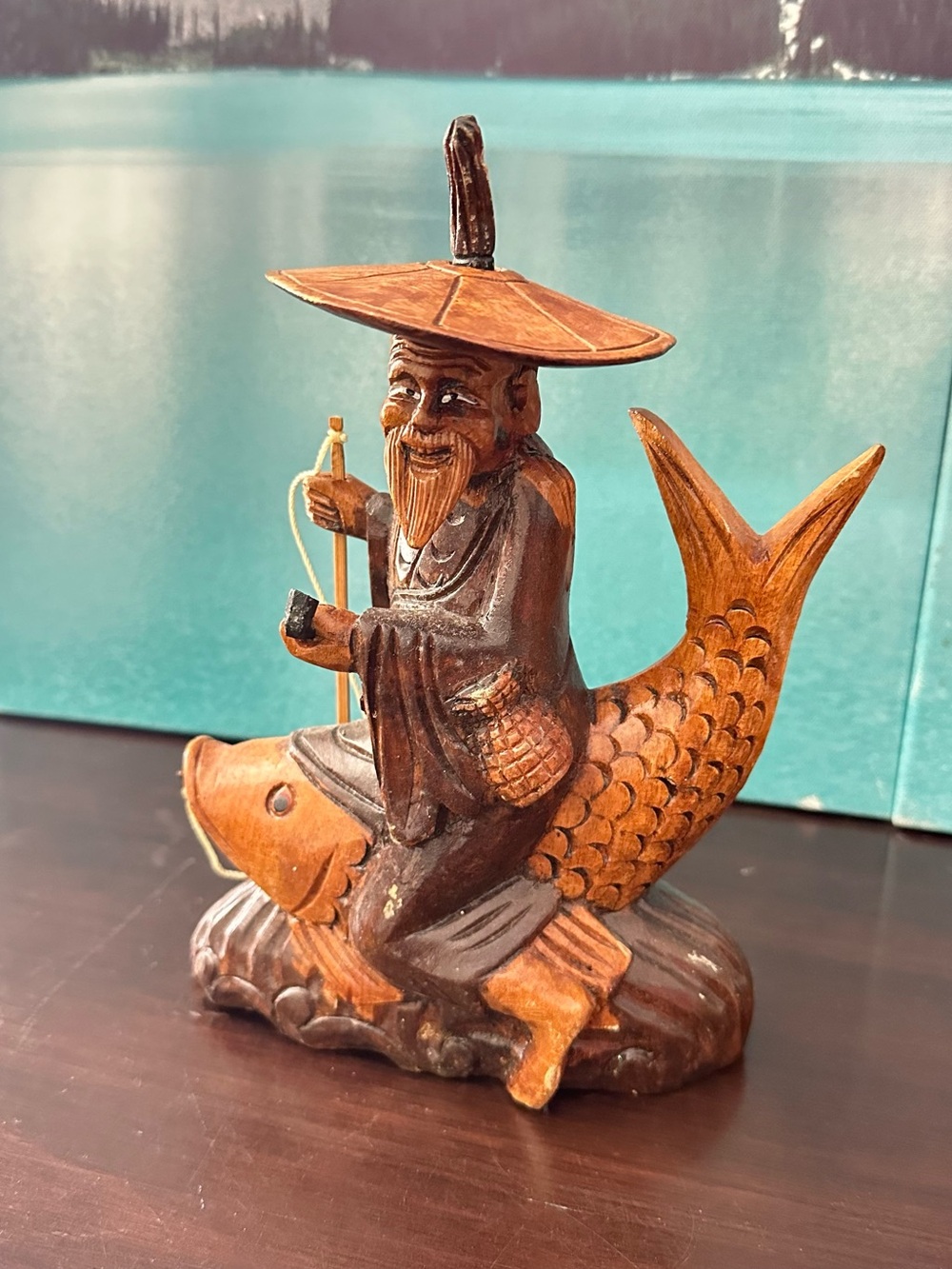 Hand-Carved Wooden Fisherman on Fish Figurine - Brown